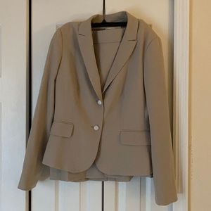 This is a Calvin Klein, tan suit, size 10